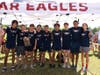 Milton Varsity boys with their 1st place trophy at the War Eagle Invitational