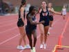 The girls 4x800m relay earned a region title with junior Emerson Armistead (r) handing off to fellow junior Leelah Dennis (l) midway through their race.