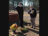 NJROTC cadet salutes while Kennesaw citizen lays wreath