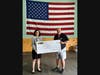 From left: Tunnel to Towers Director of Development for National Programs Cahill Zoeller officially accepts a $2,530 fundraising check from PACT Chief Operating Officer Rodger Mort at the company's Watertown, CT headquarters.