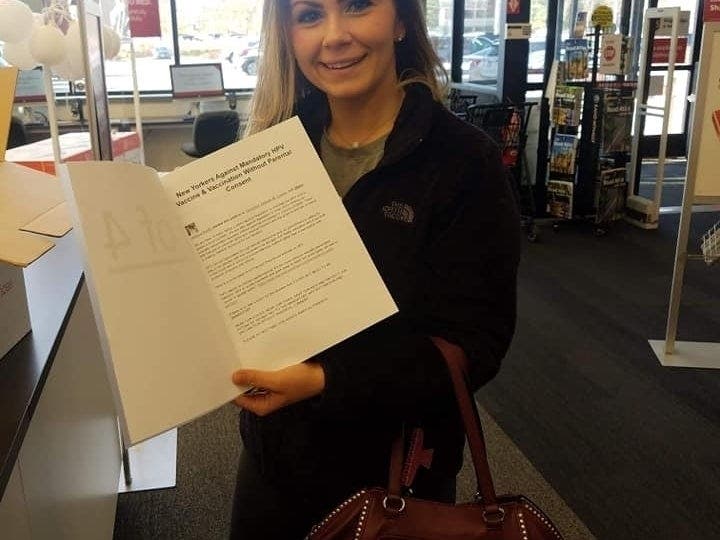 Jessica Rudin Holding a copy of HPV vaccine petition she created & mailed to elected officials.