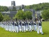 Cadets march in formation at the U.S. Military Academy at West Point. The Capel is the background.