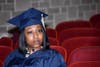 2019 graduate, Corneisha Robinson listens to speeches during graduation from 13th Year Program