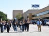 Bloom Township band walks down the driveway at the Ford plant as they prepare to perform for Hispanic Heritage month.