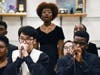 Bao Khoi (KJ) Tran and Logan Driver make beatbox sounds while Marian Catholic combined choir sings "Africa"