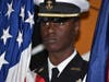 Raphael Aikens Jr. from Chicago Heights a member of  Bloom Township NJROTC stands at attention during the Veteran's day ceremony