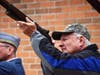 Phil Faso from Chicago Heighhts takes part in the 21 gun salue during the Morning of Reflection in Chicago Heights