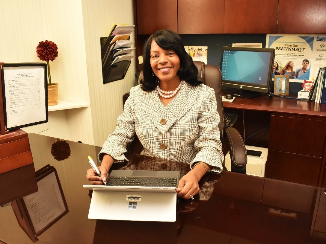 Dorith Johnson, Assistant Superintendent of Curriculum, Instruction, Assessments and Grants for Bloom Township District 206 in her office