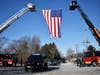 Chicago Heights and Flossmoor Fire departments hung an American flag in honor of Chicago Heights fallen police officer Gary Hibbs. 
