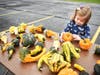 Olivia Denlinger checks out pumpkins and gourds at Trinity Lutheran Church's Pumpkin Patch. The patch is open Friday and Saturday from 11:30-6:30PM in the parking lot of the church. 