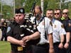Opening the Memorial Day Ceremony in South Chicago Heights is piper Tom Houts playing Balmoral. The South Chicago Heights firefighters follow closely behind.