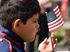 Waving an American flag, Luis Gonzalez during the Memorial Day Ceremony in South Chicago Heights.