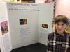 Sixth grader Kyle Pool, of Exeter, with his Pursuit of Happiness project that compared themes from Greek Mythology to those in a Marvel movie. 