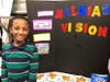 Malkias Sering, a sixth grader from Newmarket, with his Pursuit of Happiness Vision Board. 