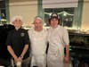 Chef Paul Callahan, of Vino e Vivo, with Orion Raczek and Will Berkenbush, two local high school students who work at the restaurant. 