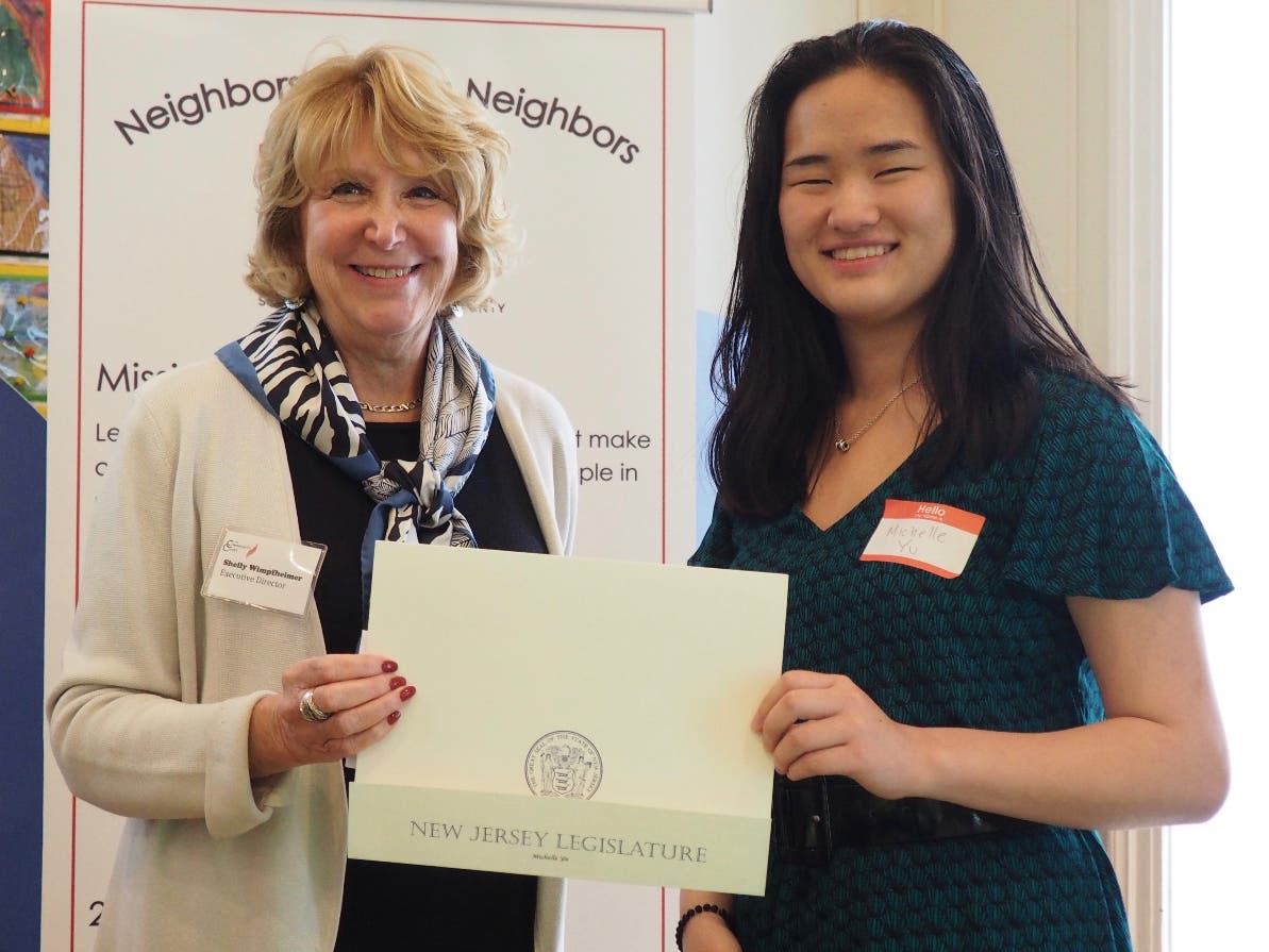 1) Dr. Shelly Wimpfheimer, Executive Director of The Community Chest, presents Michelle Yu with the 2018 High School Young Woman's Leadership Award.