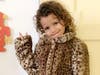 Children from West Side Infants & Children's Program and Bergen Family Center received outerwear donated to The Community's gala in the auction's 'support a program'.