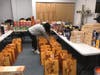 A Metro Community Center volunteer sorted bags of foods to distribute to consumers.  The Center received a grant from The Community Chest's Coronavirus Emergency Response Fund.