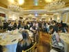 The Garden City Hotel's Grand Ballroom, filled to capacity with news media and business leaders 