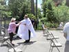 Fr Vladimir, pastor of St. Paul - St. Ann, distributes communion following ADNY new rules