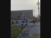 Tariq Brown snags a TD pass as defenders swarm him to prevent it.