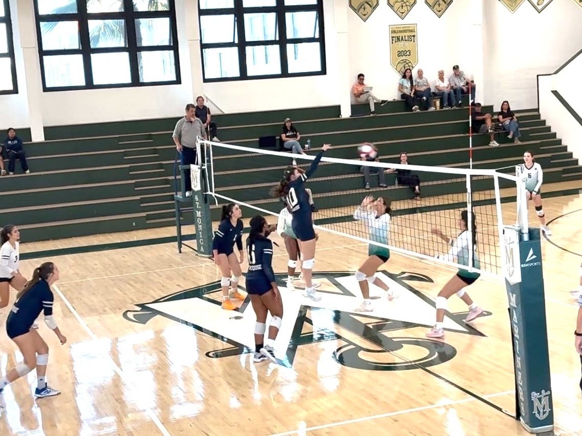 Emma Mefford smacks the ball down on Saint Monica's. She's originally from Pismo Beach.