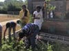 6th grade students at Howell Road Elementary School harvest the carrots they planted this past spring and raise them up with pride. 