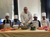 Centerplate Executive Chef Drew Revella and Howell Road students standing with their prepared produce before creating their dip.