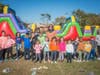 Students of Valley Stream UFSD Thirteen’s Willow Road Elementary School posing in front of the inflatable obstacle course at the annual Fall Festival. 
