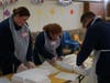 (L-R) Greybarn staff members Kristin, Kim, and Michael Loeffler volunteer at the Circle of Love Ministry to help package and deliver more than 2,000 Thanksgiving dinners to area residents in need.