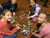 A group of East Woods students laying out the LEGOs they plan on using to make holiday decorations for children in need of play this holiday season.