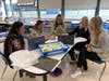 5th grade teachers from James A. Dever Elementary School learning how to build and code a robotic arm. They will be teaching this to their students in the new Innovation Labs with the goal being to have the arm to pick up and put down various objects.