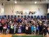 Valley Stream Thirteen Willow Road Elementary School students with New York Islanders mascot Sparky the Dragon and representatives from the team during their interactive assembly.
