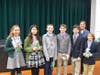 (L-R) Veronika M., Grade 5, Lilah B., Grade 6, Landon C., Grade 6, Logan T., Grade 7, Sam L., Grade 8, Jeanne Lore, Upper School Science Teacher and Hudson G., Grade 5 with their awards at the Science Symposium