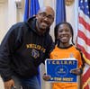 John Frias, Principal at Wheeler Avenue School awarding Estelle Barbot, grade 2 with a C.H.I.R.P. award for displaying courteous behavior with students and teachers.