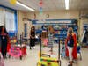 Superintendent Dr. Rianna (second from left) and Deasy Elementary School Principal Melanie Arfman (second from right) admire the creative classroom design of teacher Casey Lynch and monitor Serfedis Gomez.
