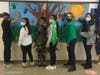 Connolly students that demonstrated leadership qualities imprinting their hands on the “7 Habits Tree,” a representation of how they have made their stamp on the school community.
