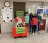 From L to R: Freshman students Mark LaRocca, Ava Scagliola, Sasha Brennan, and Phoebe George with various pet supplies collected for Cove Animal Rescue.