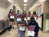 Top row L to R: Amelia Decker, Kalia Sol'e Edwards, Arden Jimenez, Siena Scagliola, Michelle Pinilla Hernandez. Bottom row Left to Right: Benjamin Napolitano and Christopher Villatoro Lopez.