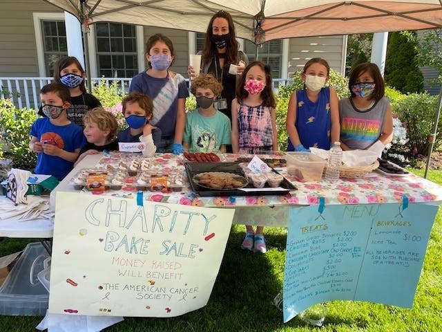 Third-graders in Mrs. Katz’s class selling treats and baked goods to raise money for the American Cancer Society.