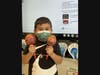 Lawrence Primary School student Luis Escorcia Orozco, grade 1, shows off his maracas, rattles which appear in many genres of Caribbean and Latin music.