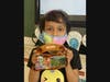 Carla Mejia Moran, grade 1, displays her personal item to the class, representing her El Salvadoran heritage.