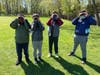 Third grade students at Landing Elementary School take a trip outside for a bird walk and use binoculars to study the wildlife.