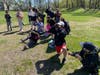 Third grade students at Landing Elementary School take a trip outside for a bird walk and use binoculars to study the wildlife.