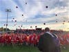 The graduating class tosses their caps in the air at the conclusion of the ceremony.