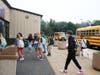 North Country Road Middle School students arriving at school and greeting their friends on the first day.