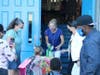 Kindergarten students at Deasy Elementary being dropped off by their parents and eager to get inside to meet their classmates.