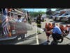 Firefighters from the Miller Place and Sound Beach fire departments let students try out spraying the fire hose.