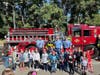 Andrew Muller kindergarteners line up in front of the fire engine sporting their new red fire hats.