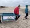 North Country Road Middle School science club students bring Peachy Keen down to the shoreline in preparation for his release back into the ocean following his rehabilitation